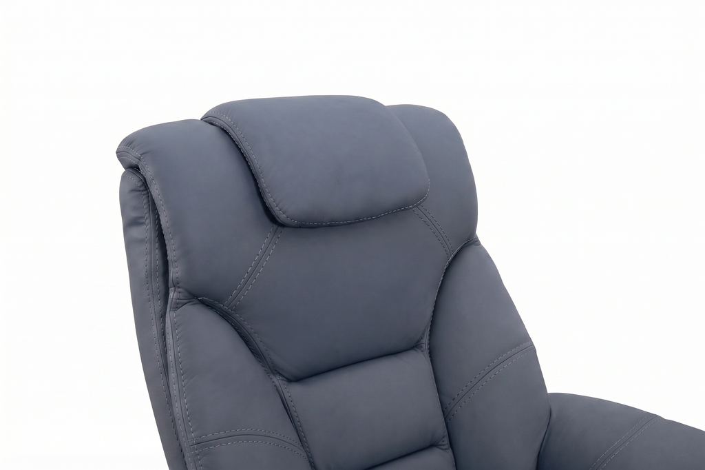 Close-up of blue euro recliner seatback with stitched upholstery and curved arms