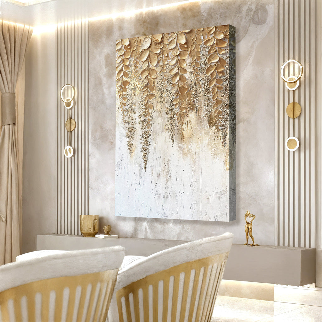 Gold and white botanical wall art canvas with 3D leaf texture above a sofa