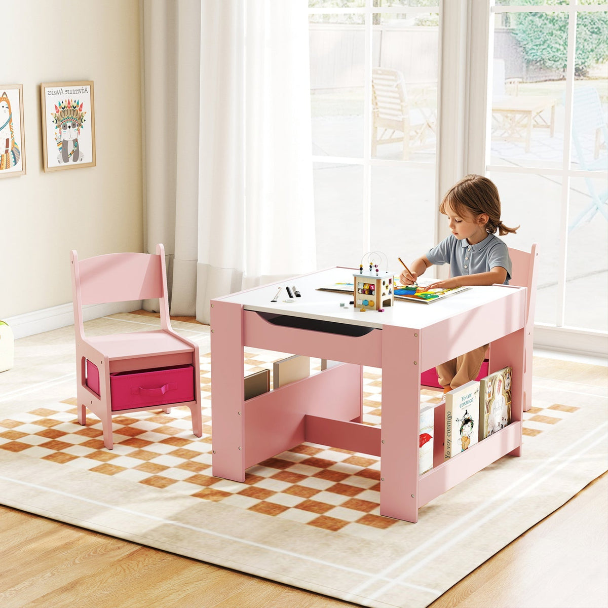 Pink kids activity table set with two chairs, open storage shelves and drawer accents