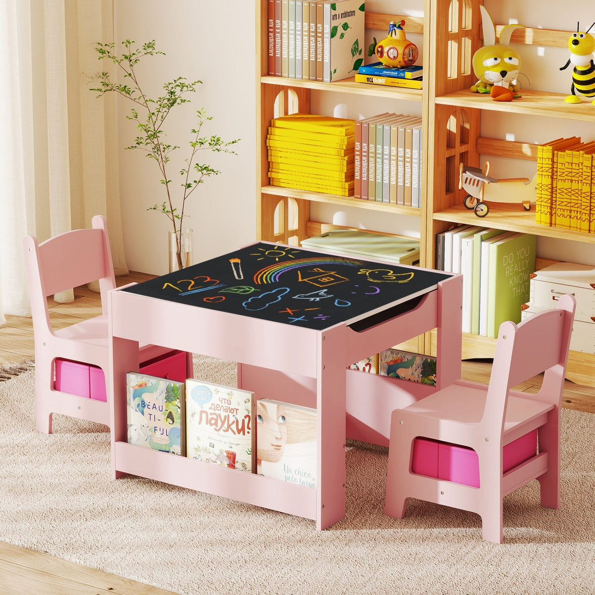 Pink kids activity table with two chairs and black reversible activity tabletop mat