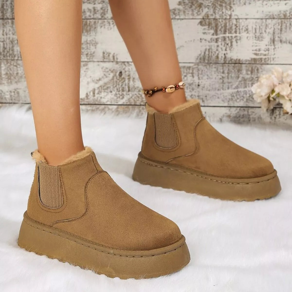 Tan suede platform ankle boots with round toe, side elastic gore, and fuzzy cuff