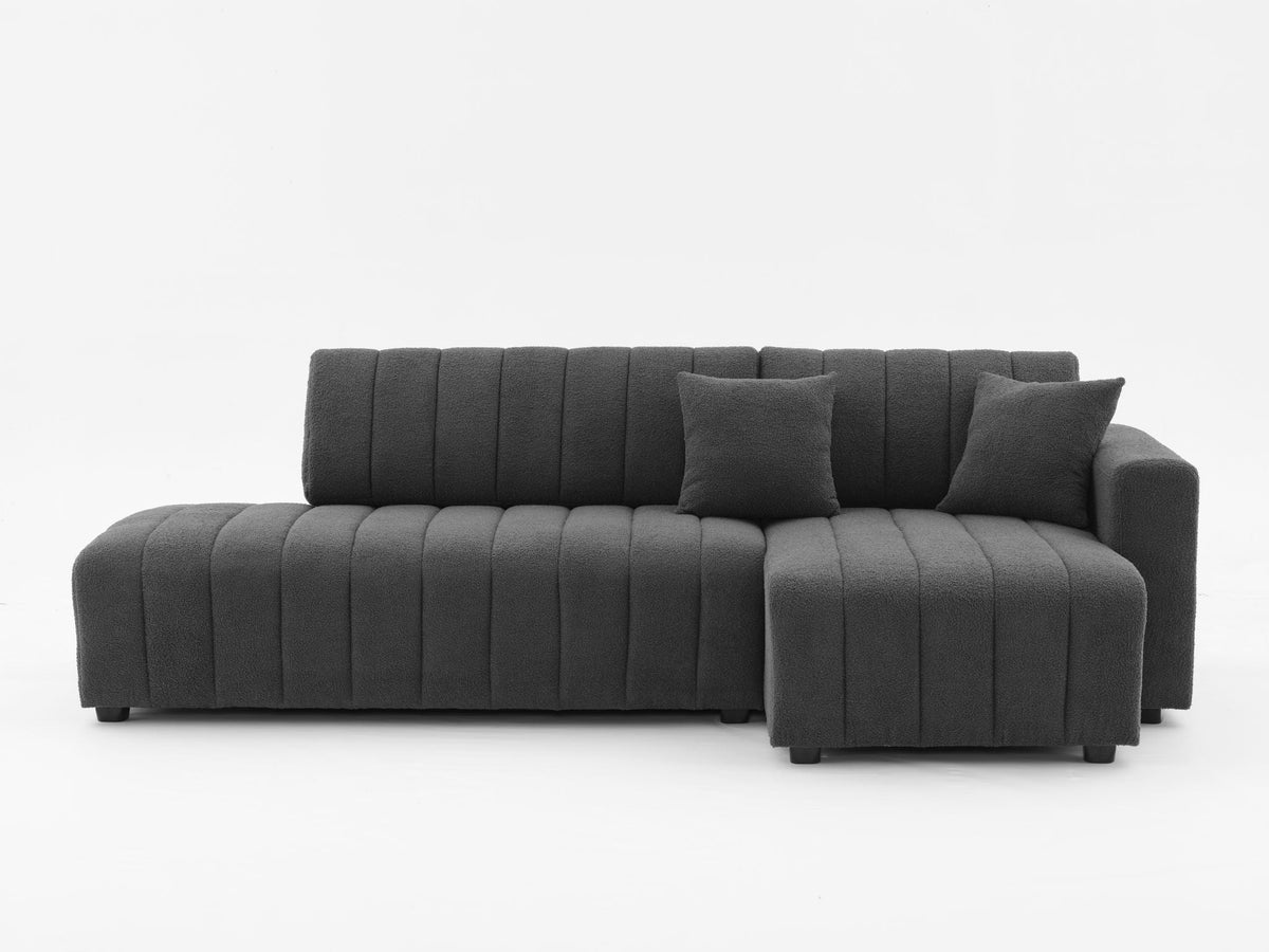 Dark gray sectional sofa with chaise, channel-tufted back and low profile