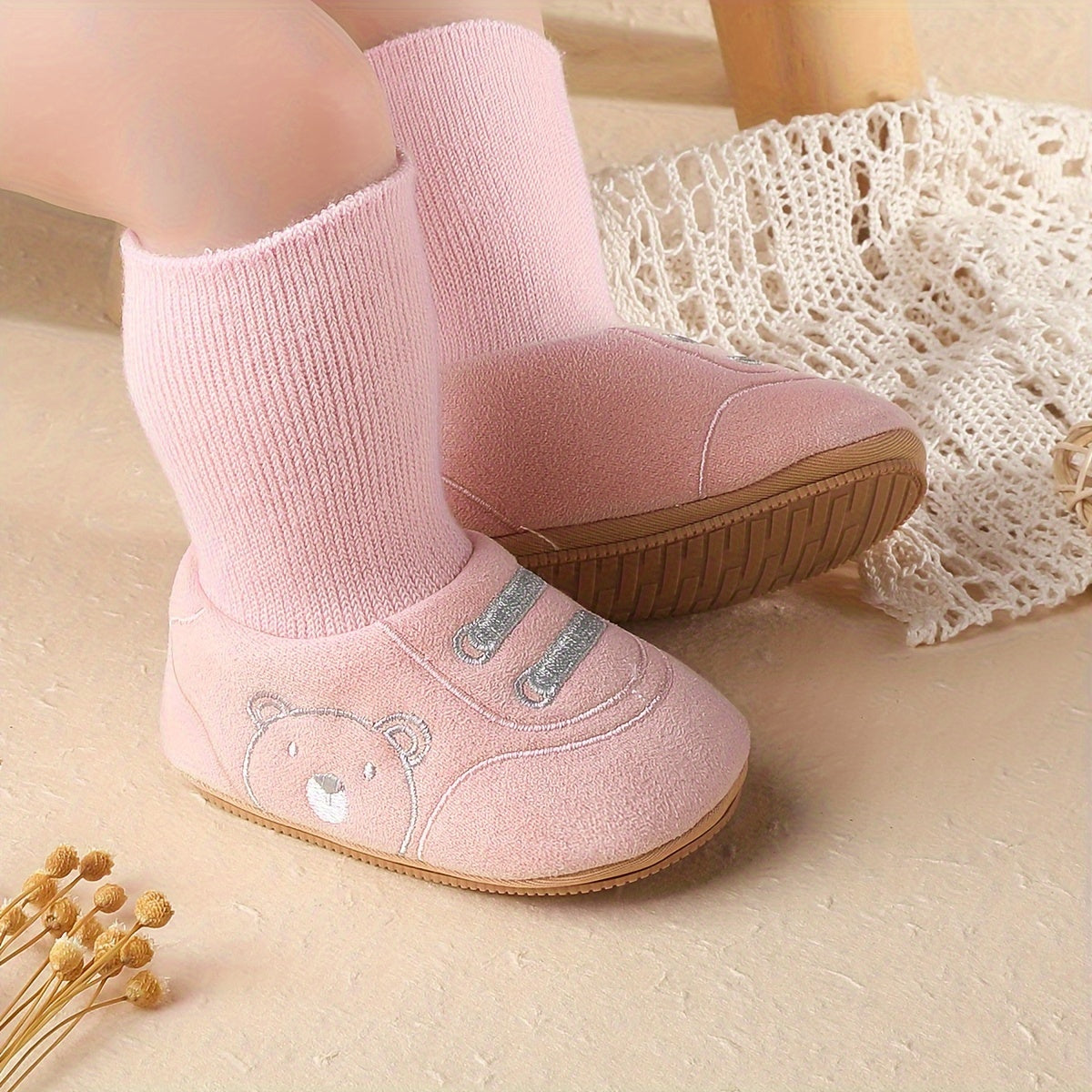 Pink baby sock booties with bear face, ribbed ankle socks, and non-slip outsole