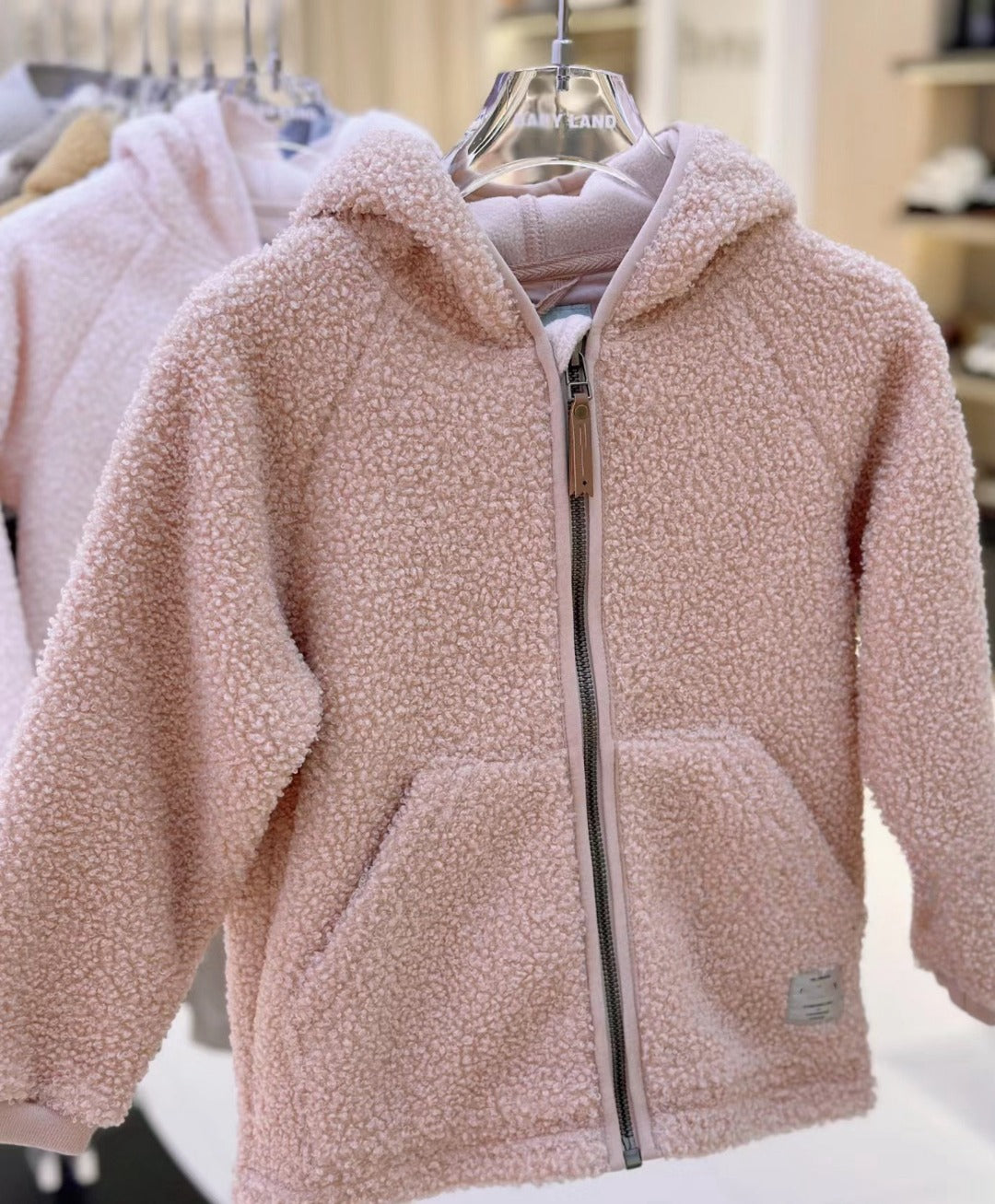 Kids fleece zip-up jacket, light pink teddy pile with front zip and small chest patch