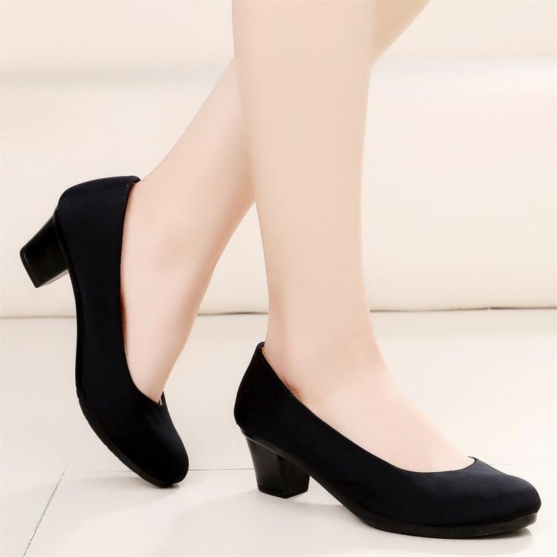 Women's black mid-heel slip-on shoes with curved topline and rounded toe