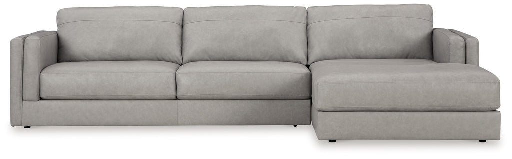 Light gray upholstered sectional sofa with chaise and three back cushions