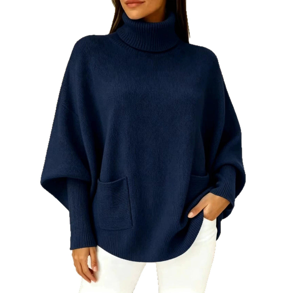 Navy women’s turtleneck sweater with long sleeves and front patch pocket