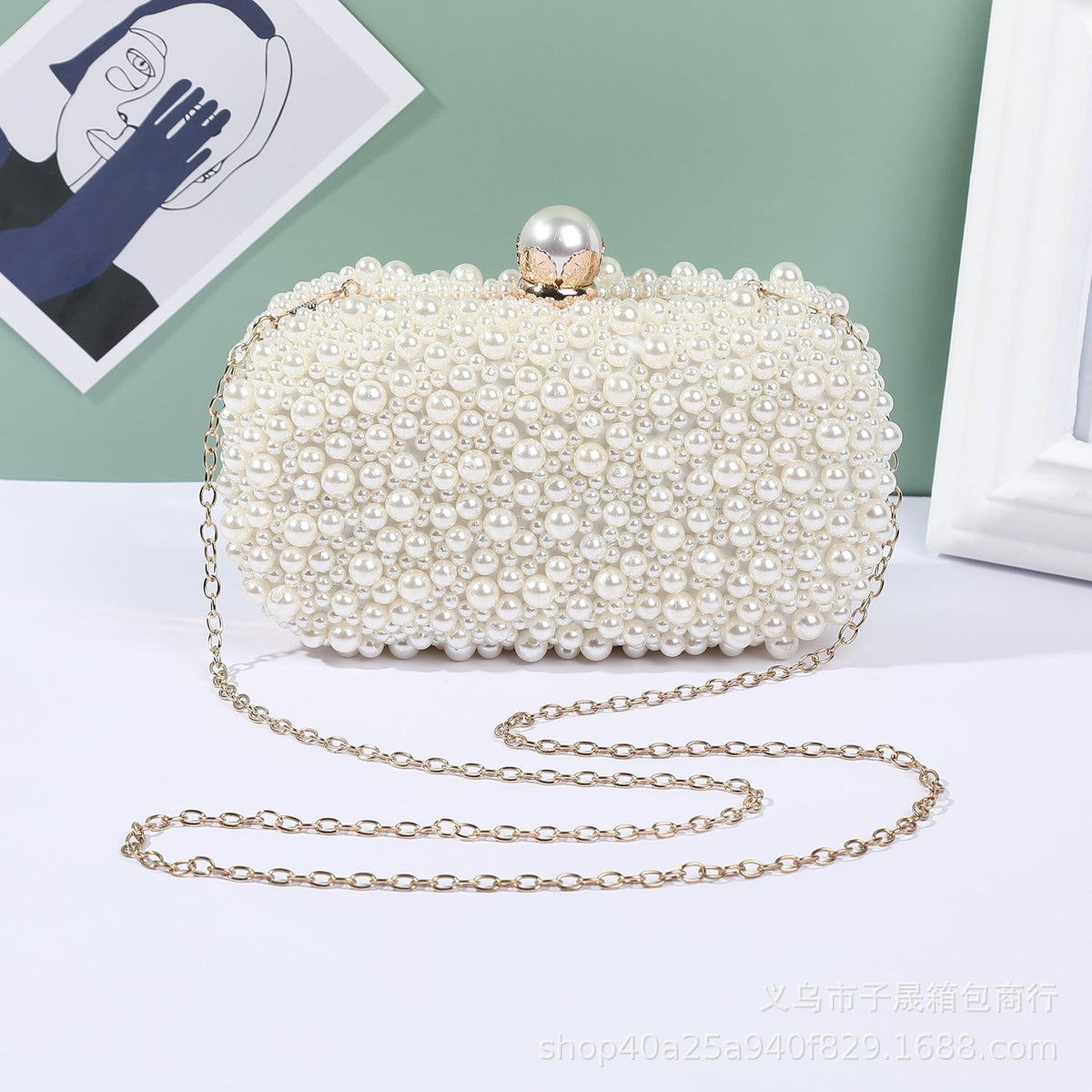 White pearl bead lock clutch with long shoulder chain and gold-tone clasp