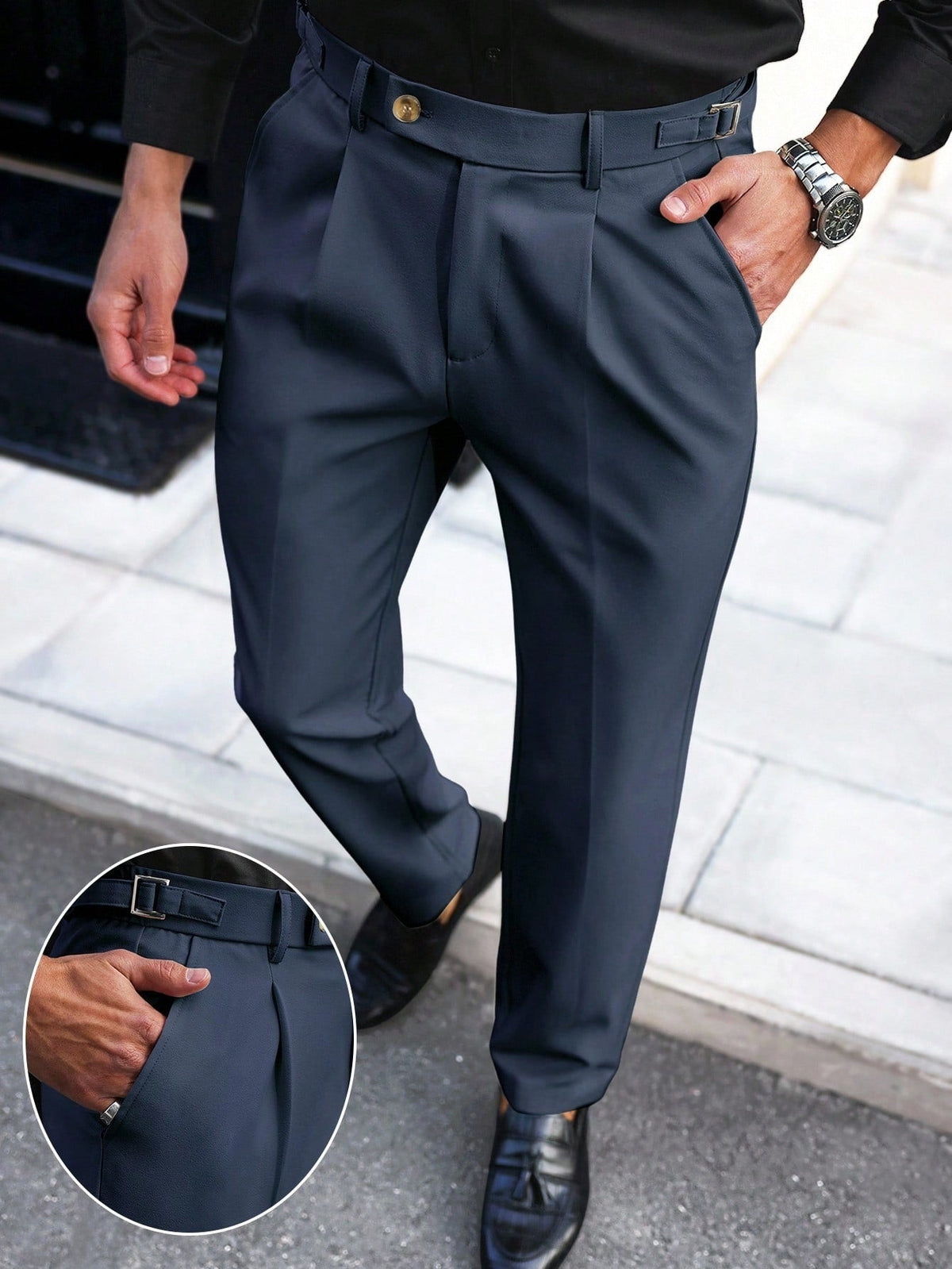 Navy straight-leg trousers with belt loops, button fly, and front pleat details