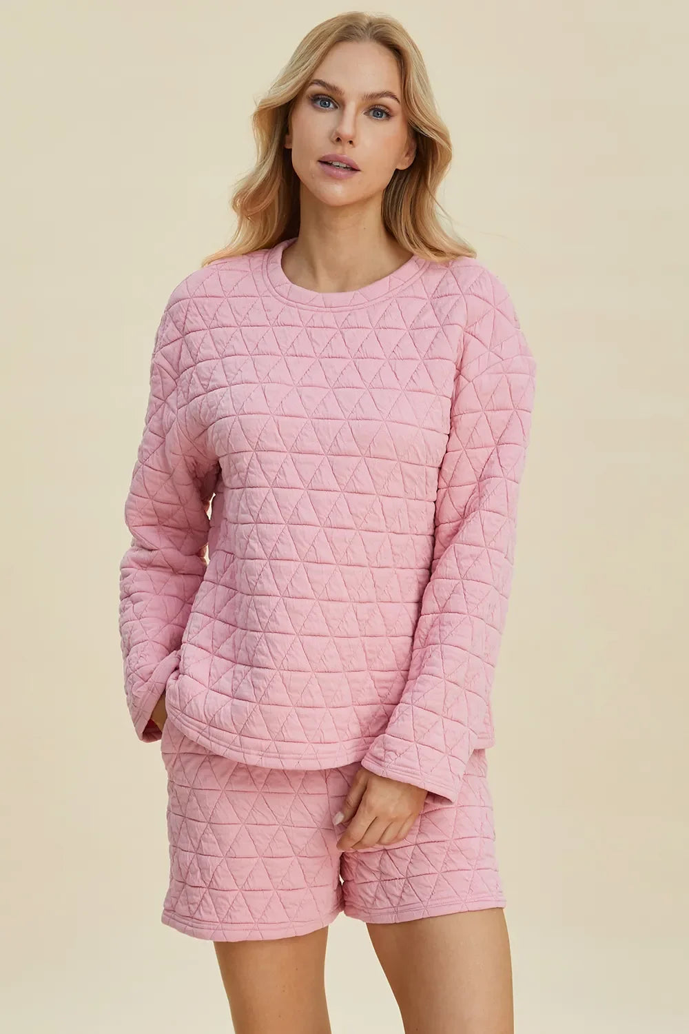 Pink textured long-sleeve top and shorts set with side tie detail at seam