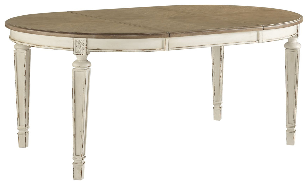 White oval dining table with dark brown top and turned pedestal legs