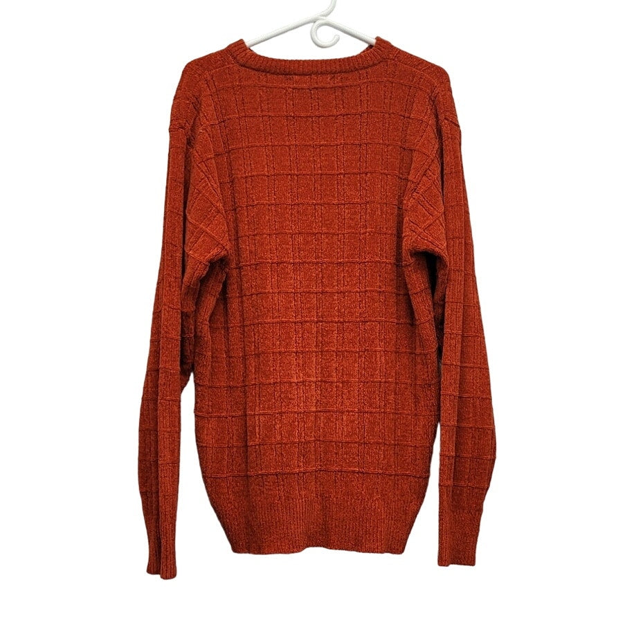 Orange textured grid knit long-sleeve sweater with ribbed cuffs and hem