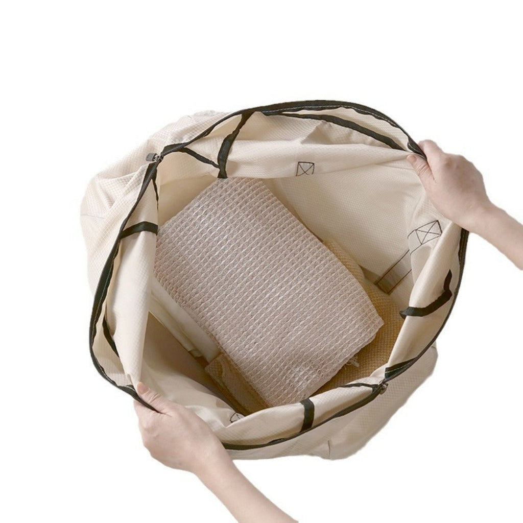 Beige foldable backpack opened to reveal inner compartments and mesh panel.