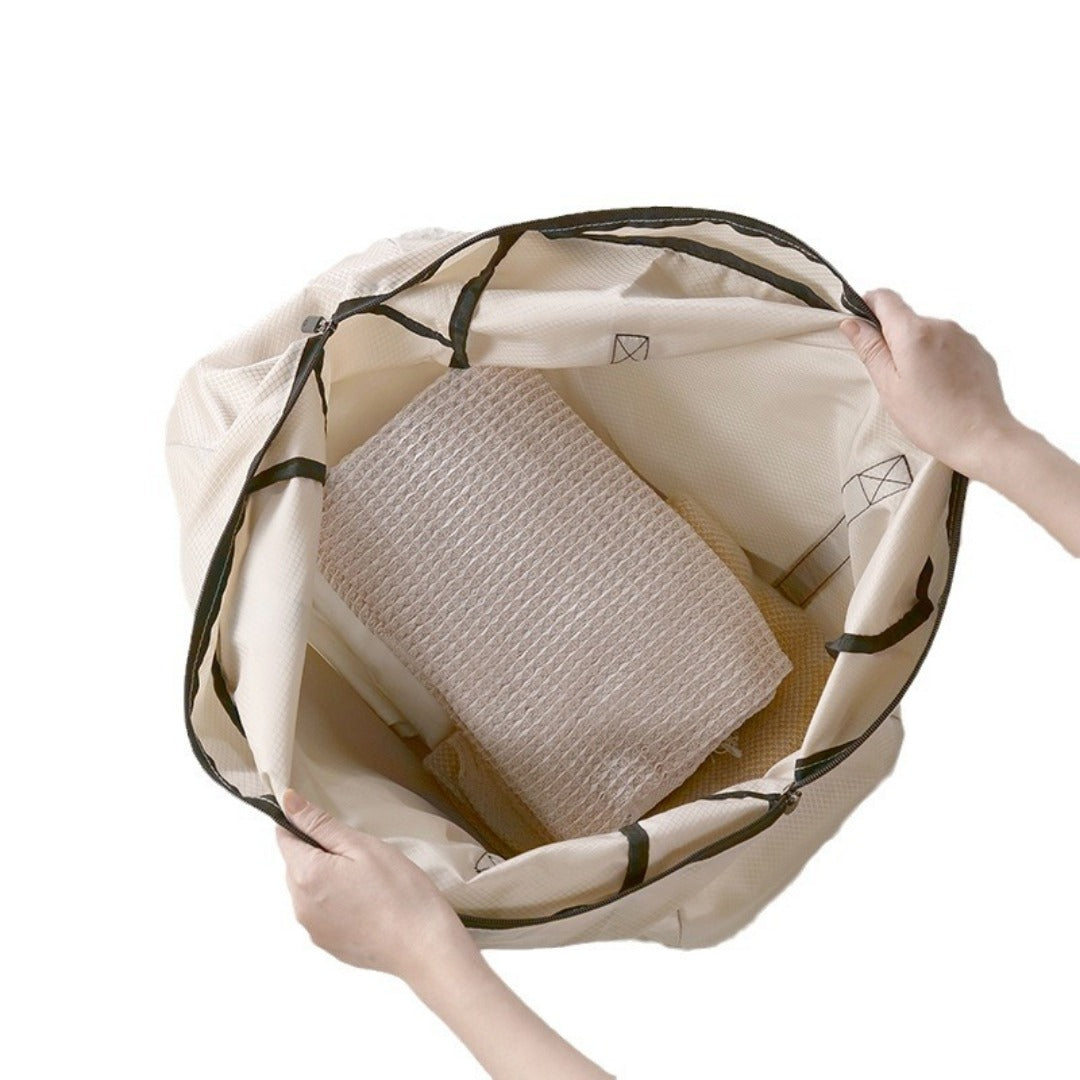 Beige foldable backpack opened to reveal inner compartments and mesh panel.