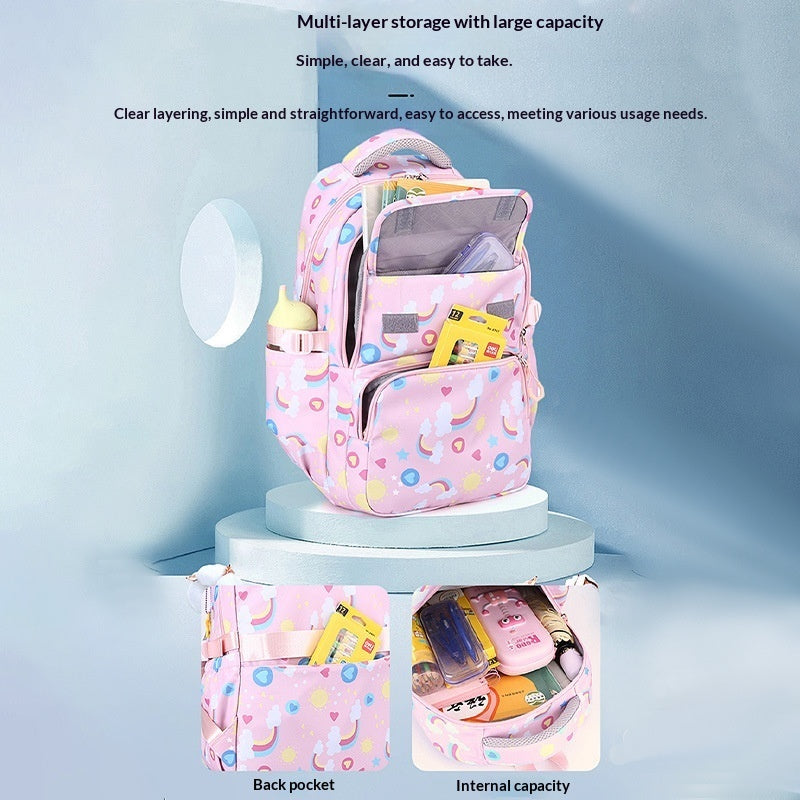 Pink unicorn-pattern backpack showing multi-layer storage with back pocket and interior space