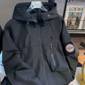 Black men's soft shell jacket with hood, zip front, cord toggles and side pocket