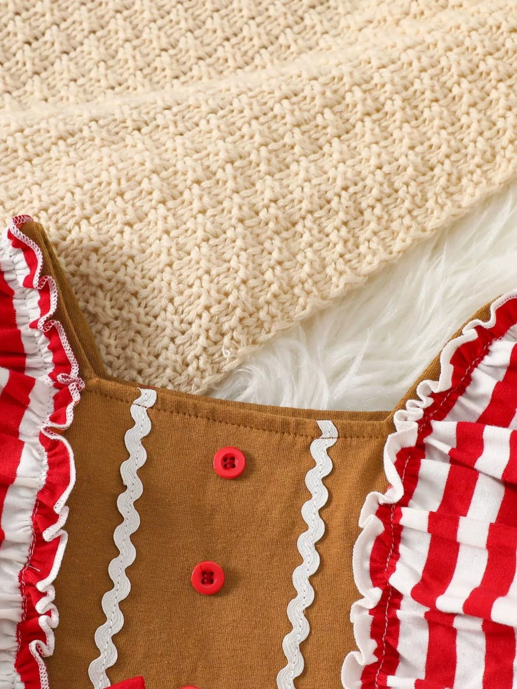 Caramel jumpsuit bodice with red buttons and striped ruffle trim