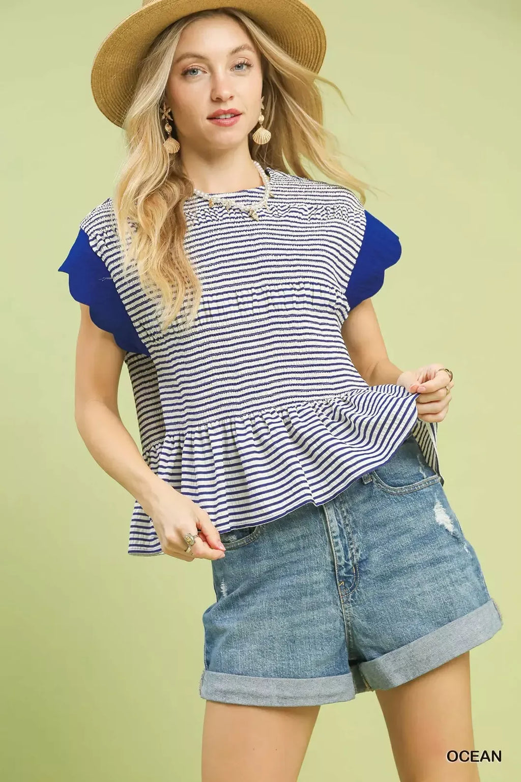 Navy-and-white striped peplum top with ruffle sleeves and smocked waist