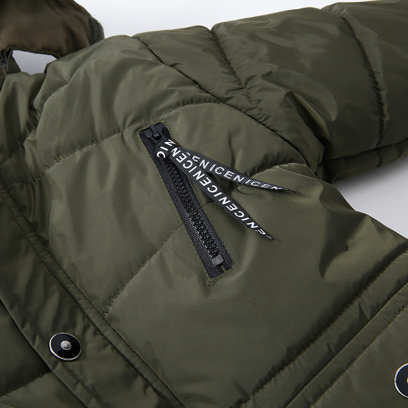 Olive green kids puffer jacket close-up: zip pull and logo patch on chest
