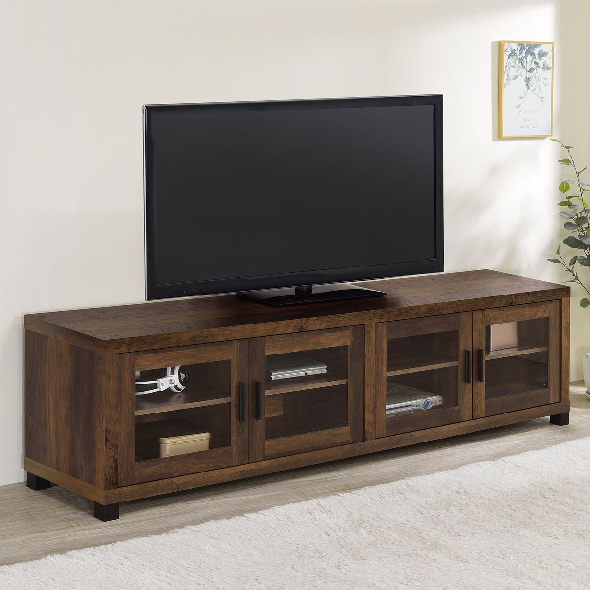 Dark pine TV stand with four doors, open shelves, and media drawers, metal bar pulls, black feet