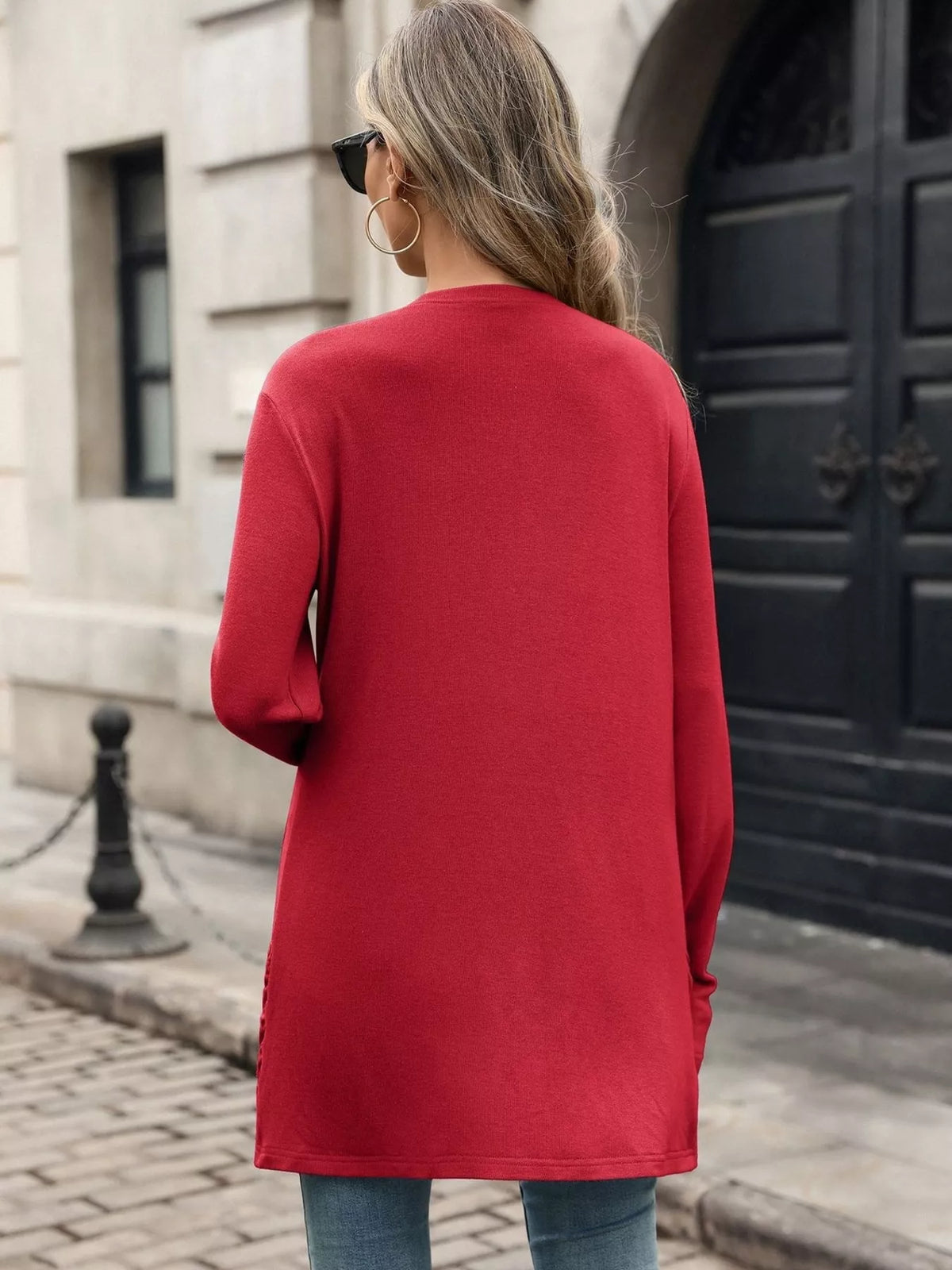 Red open-front cardigan back view with long sleeves and draped hem