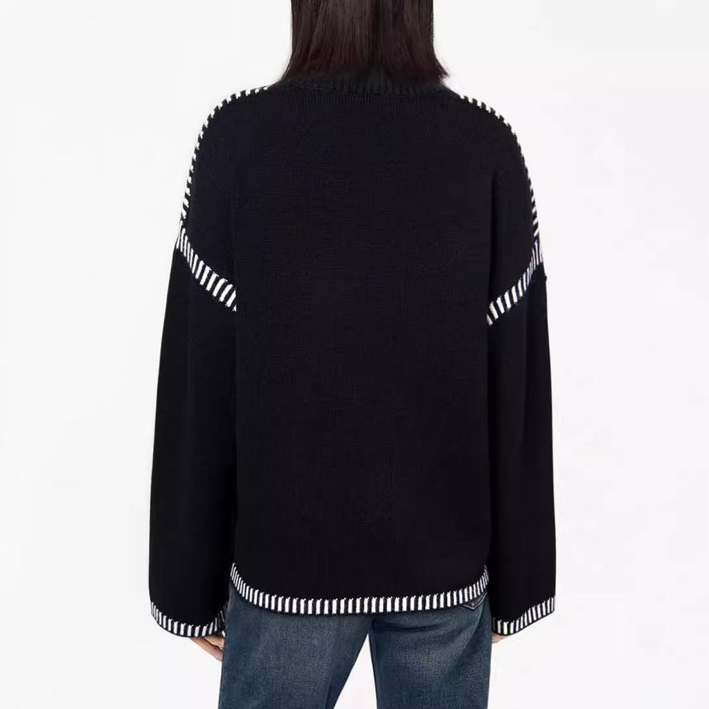 Women’s black round-neck pullover sweater, back view with striped cuffs
