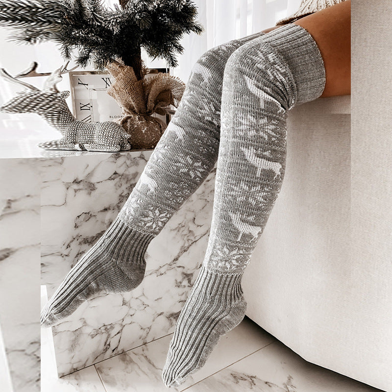 Women’s over-the-knee knitted Christmas socks in gray with white reindeer snowflake design