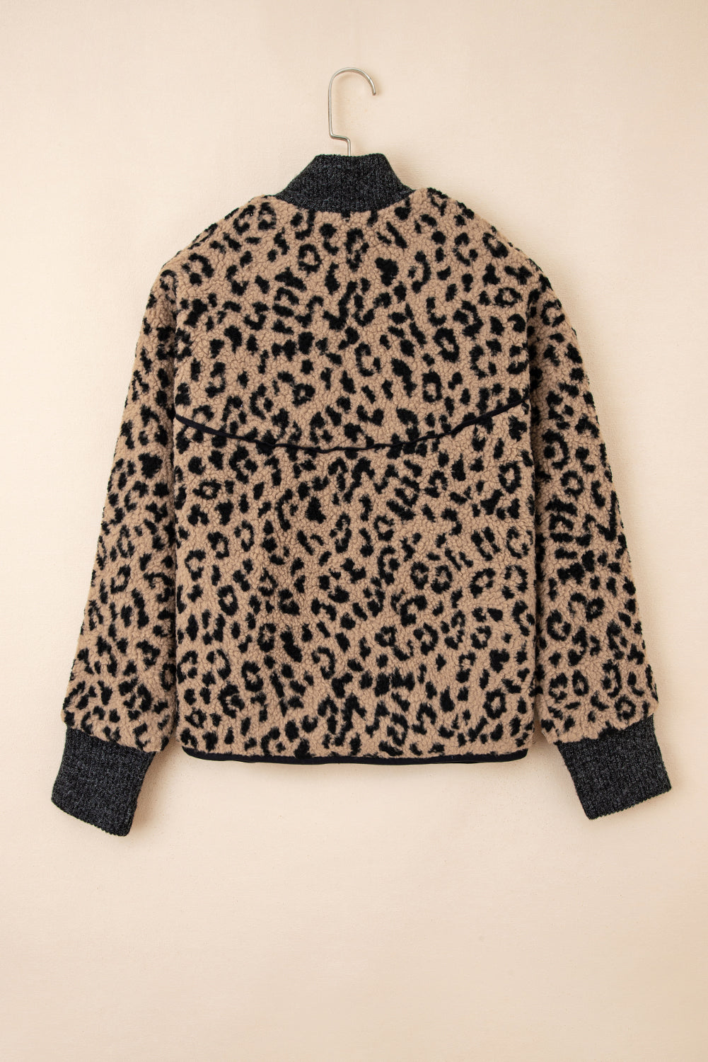 Leopard-print fleece zip-up jacket on hanger, back view with stand collar and pocket panels.