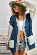 Color-block cardigan sweater in navy and ivory with button closure and patch pockets
