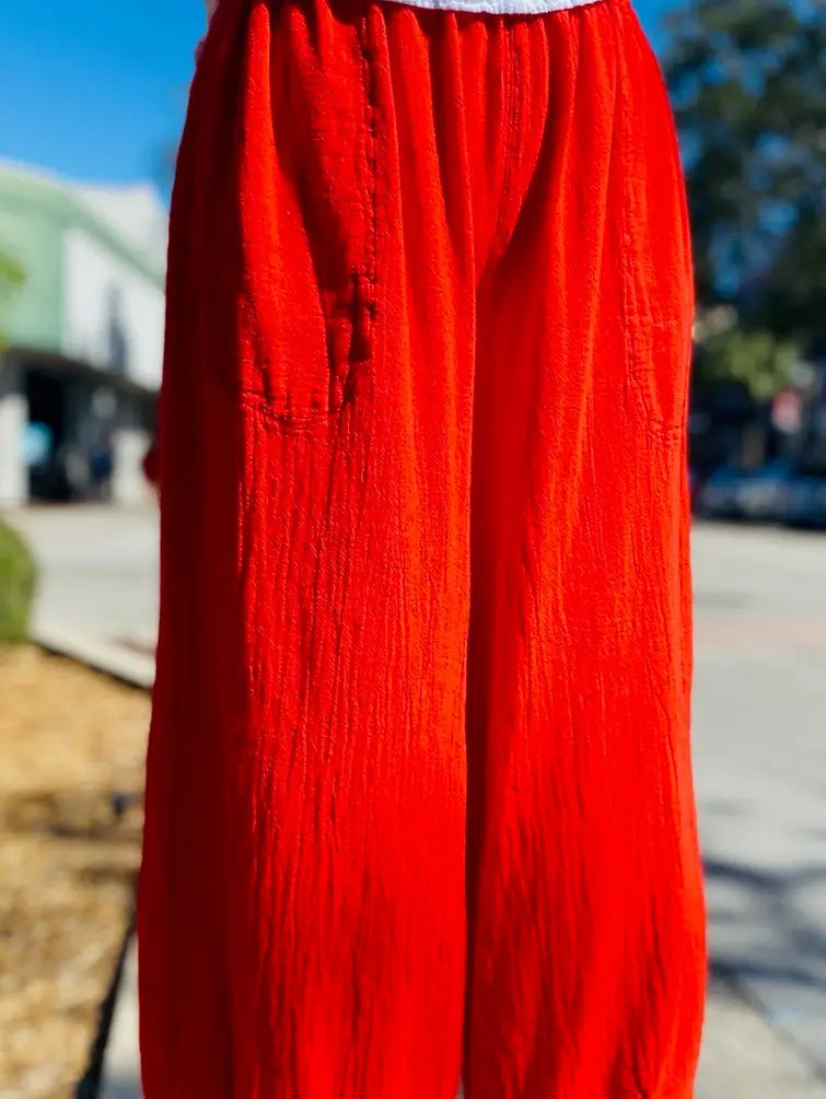 Red cotton gauze wide-leg pants with elastic waist and pleated front