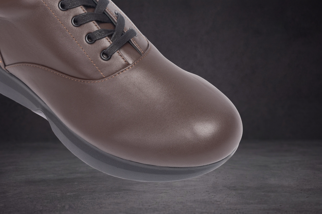 Taupe WOA sneaker toe with dark laces and smooth leather-like finish
