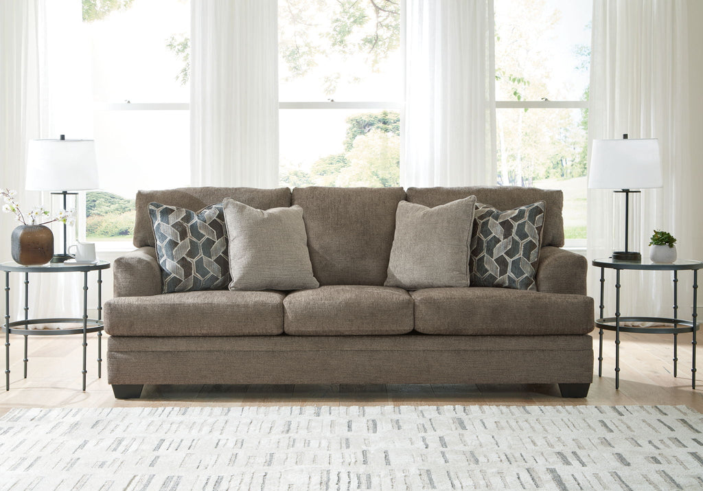 Stonemeade sofa set with patterned cushions and dark legs in medium taupe