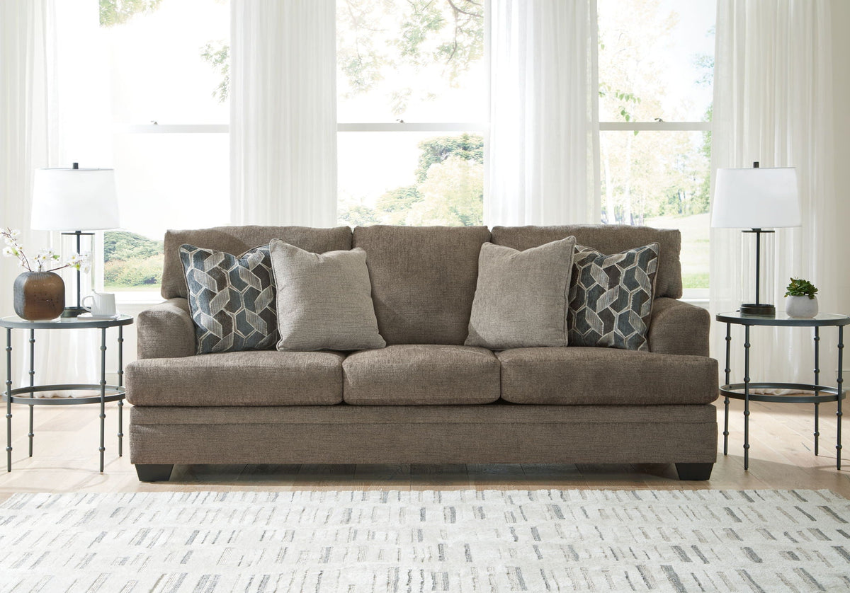 Stonemeade sofa set with patterned cushions and dark legs in medium taupe