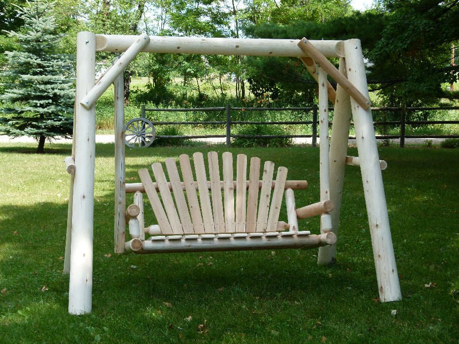 Wooden porch swing with canopy supports and white slat seat