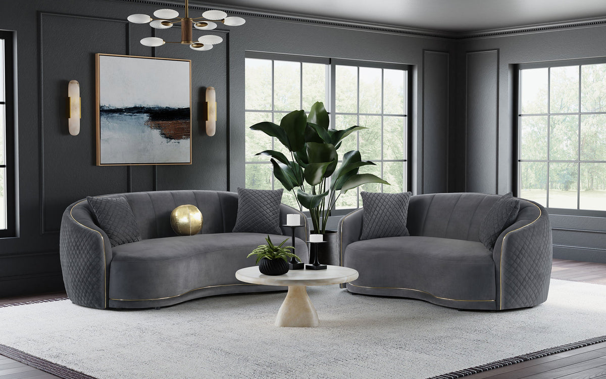 Dark grey velvet sofa set: two curved sofas with quilted backs and gold accent trim