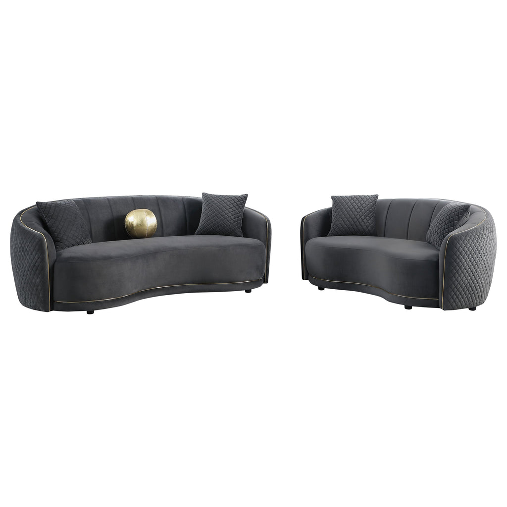 Dark grey velvet sofa set with two separate curved sofas, quilted sides and gold trim