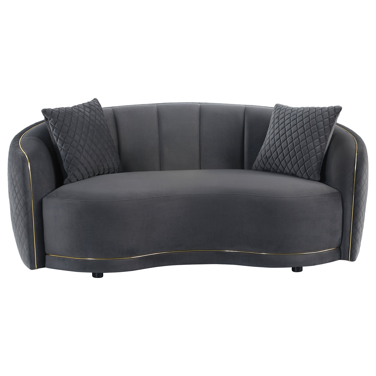Dark grey velvet two-seat sofa with quilted side panels, two accent pillows, gold trim
