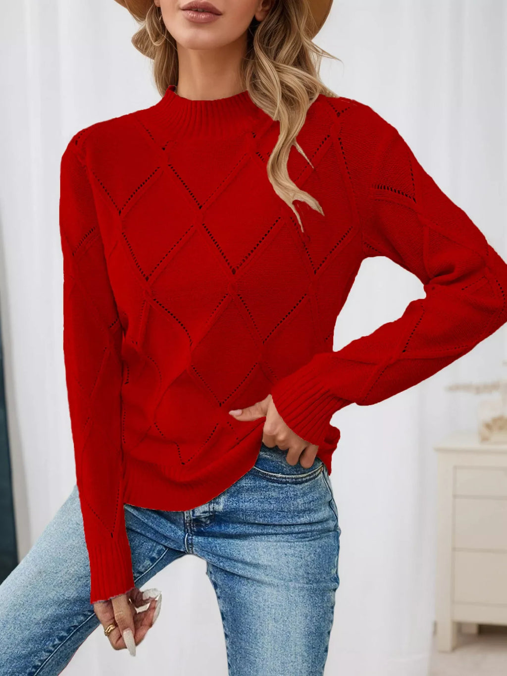 Red diamond eyelet knit top with long sleeves, crew neckline, and ribbed cuffs