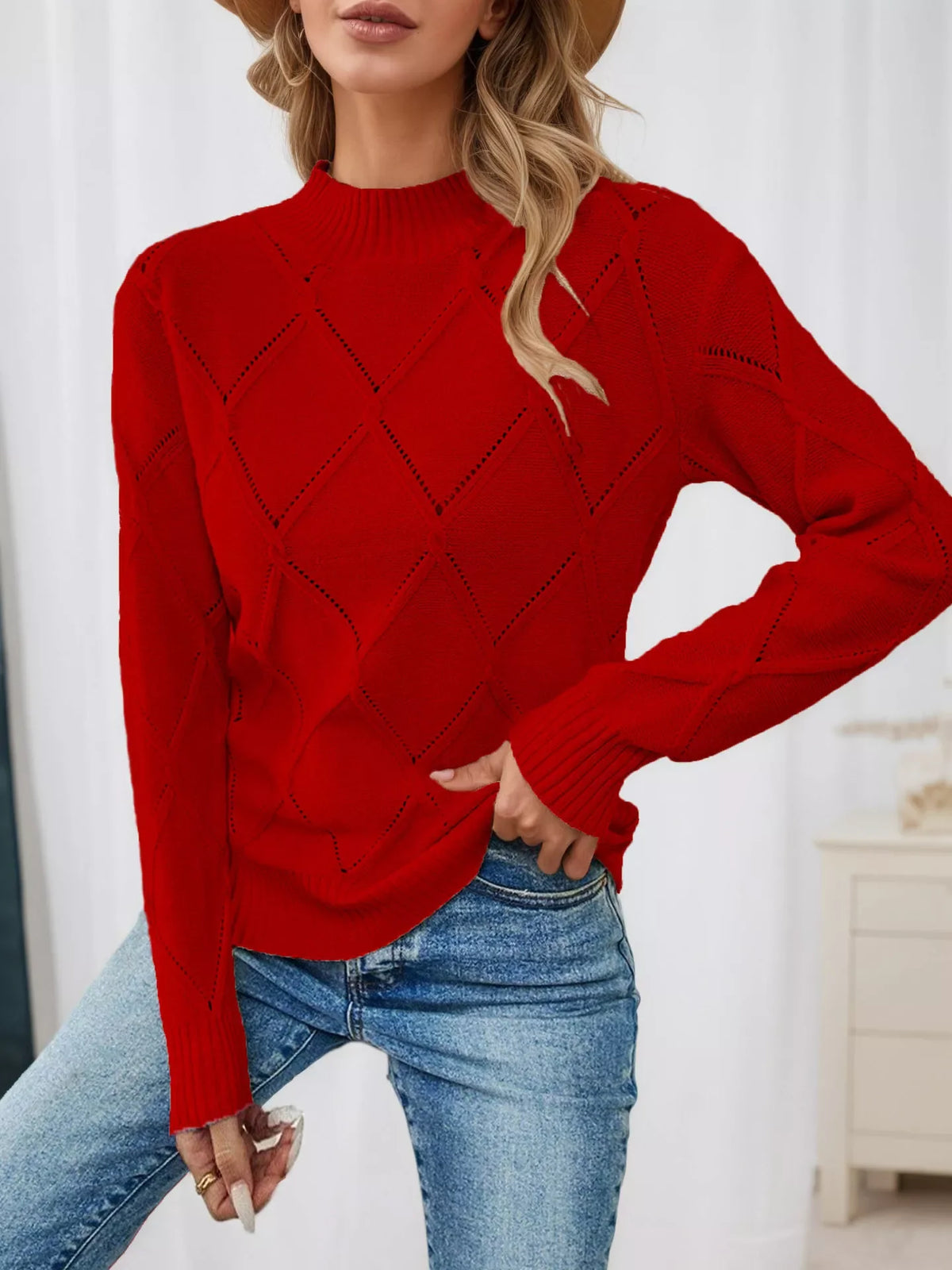 Red diamond eyelet knit top with long sleeves, crew neckline, and ribbed cuffs