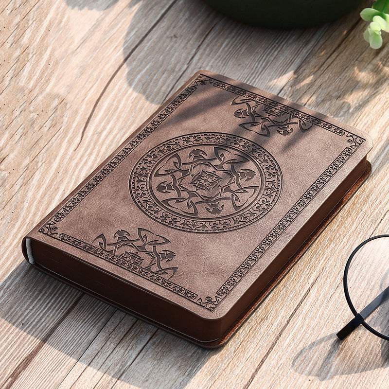 A6 leather mini notebook with embossed emblem on khaki-beige cover