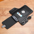 Black waist bag pouch with open pockets, buckle tab, and key ring on strap
