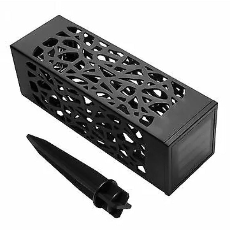 Black solar lantern housing with geometric cutout pattern and attaching spike stake