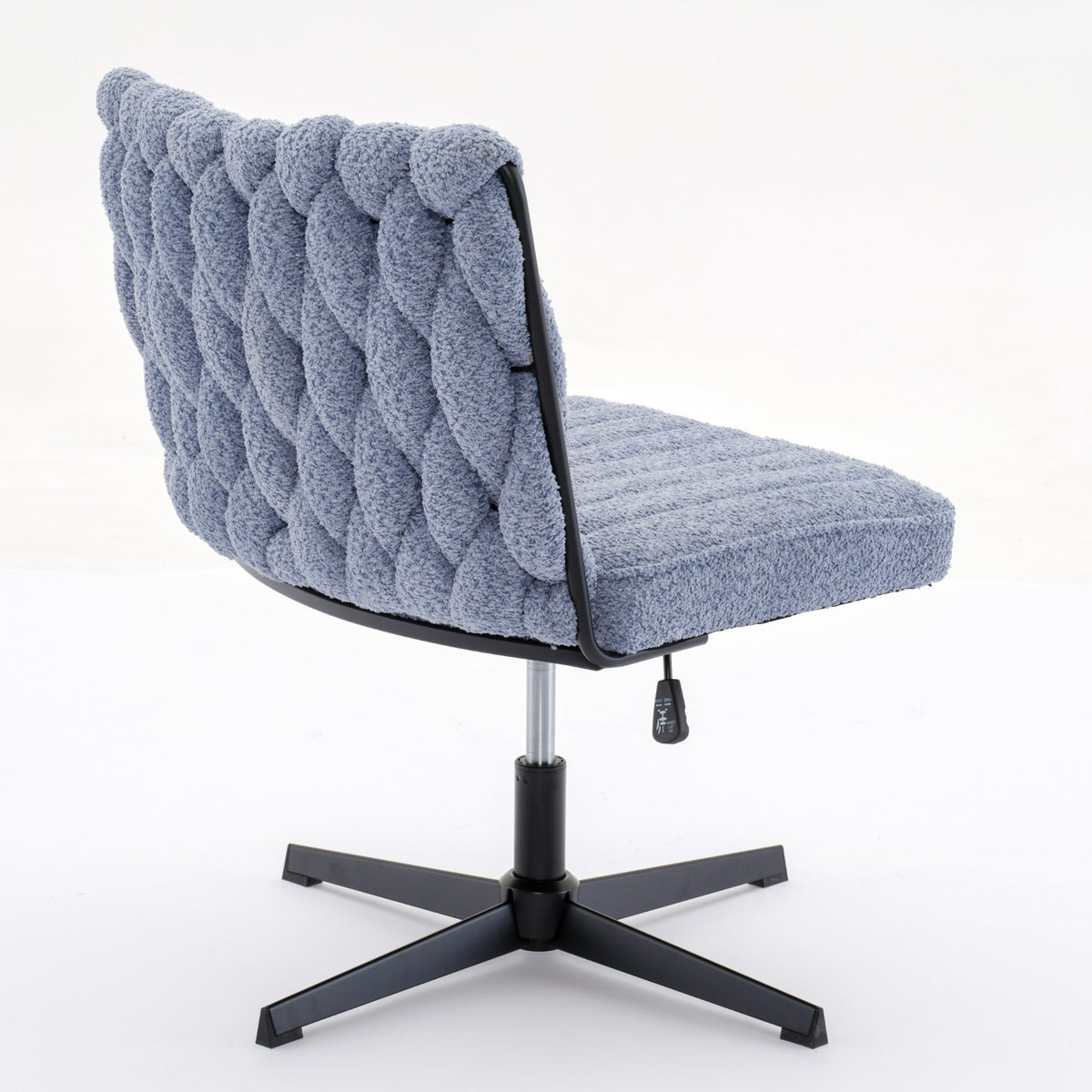 Blue armless desk chair with tufted backrest, padded seat, and black star base