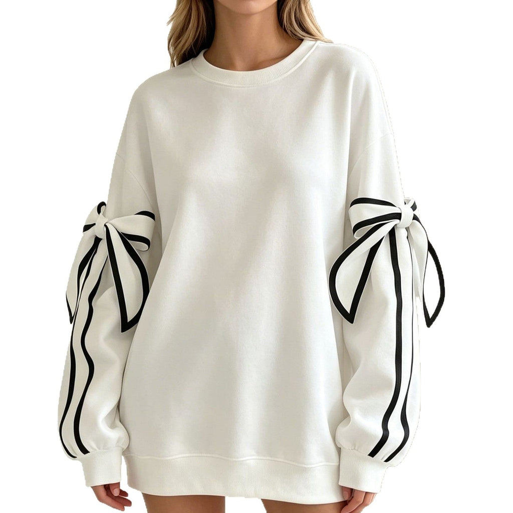 White crewneck long-sleeve sweater with black striped bow cuffs and relaxed fit.