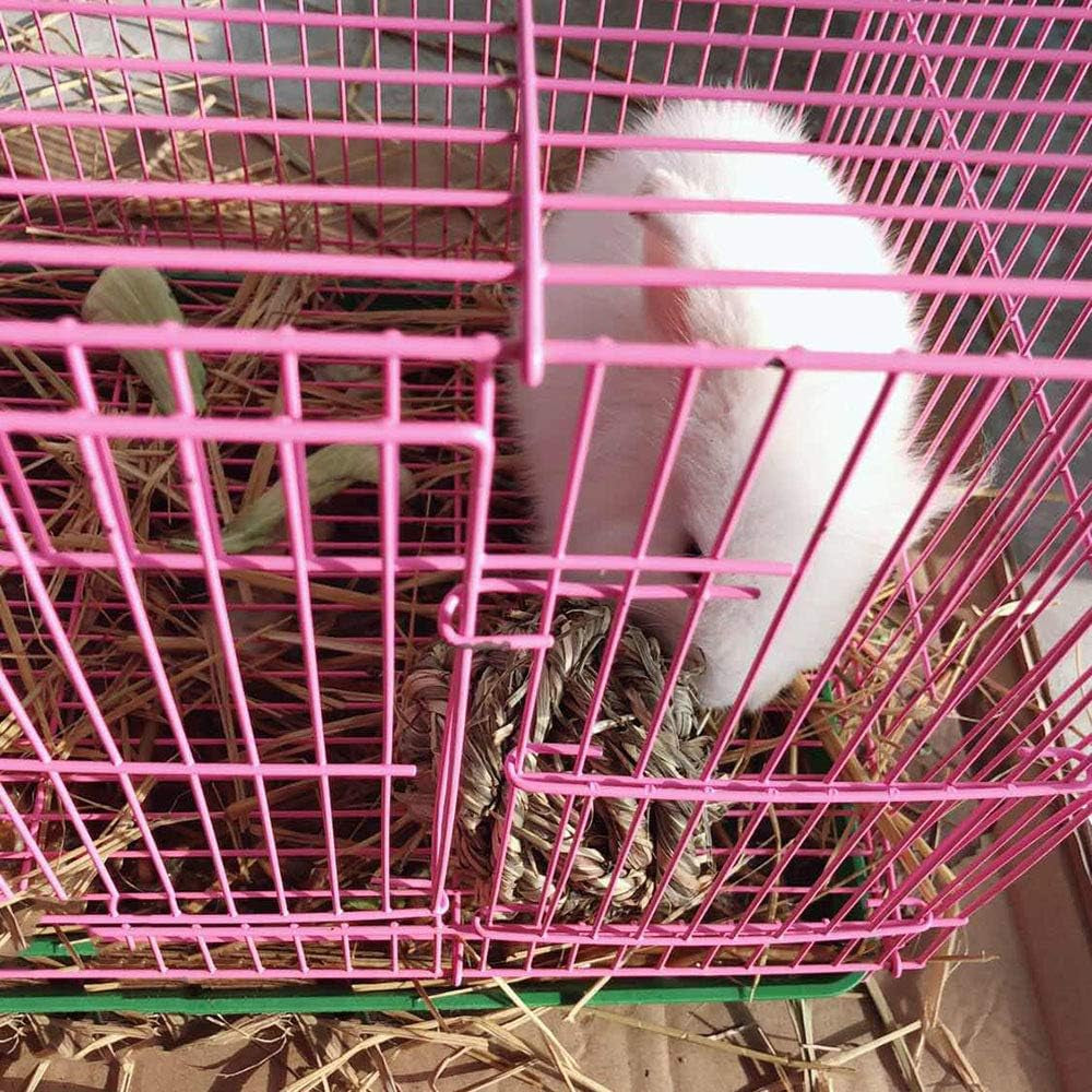 Woven timothy grass chew ball inside a rabbit cage