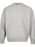 Light gray drop-shoulder knit sweater with three-button placket and ribbed hem