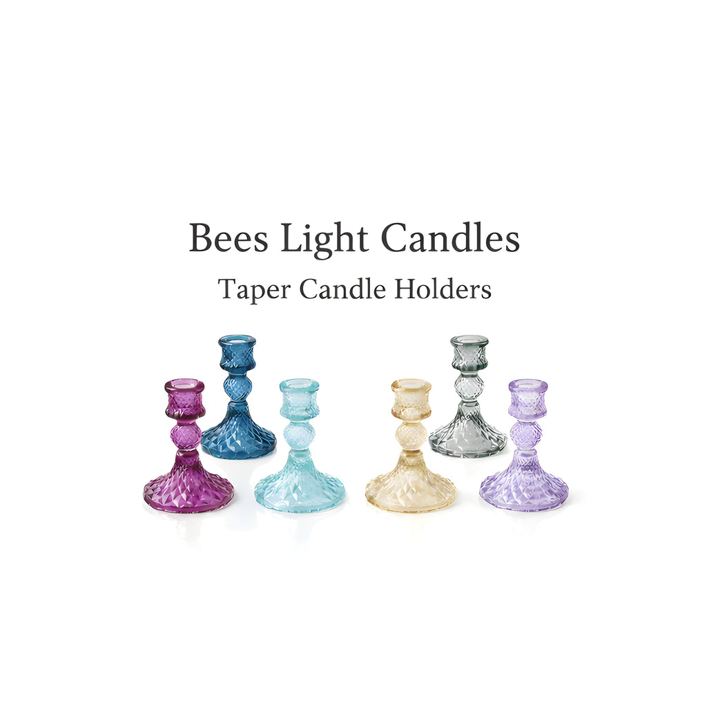 Set of colored glass taper holders in blue, purple, gold, and smoke-gray tones