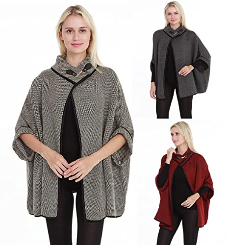 Set of grey and black poncho cardigans with buckle collar, worn over leggings