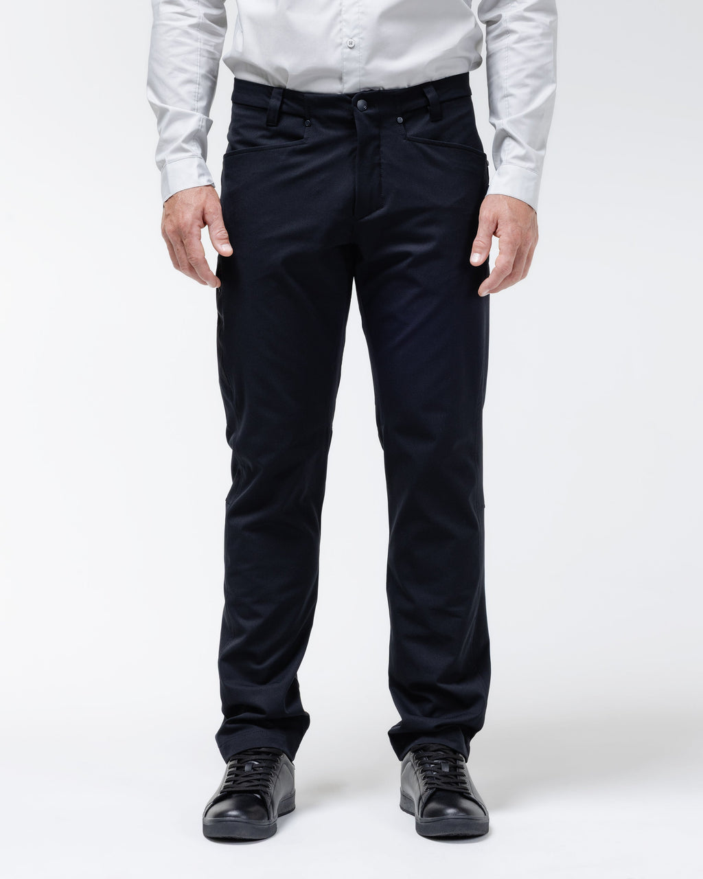Men's black chino pants with belt loops and front button closure.