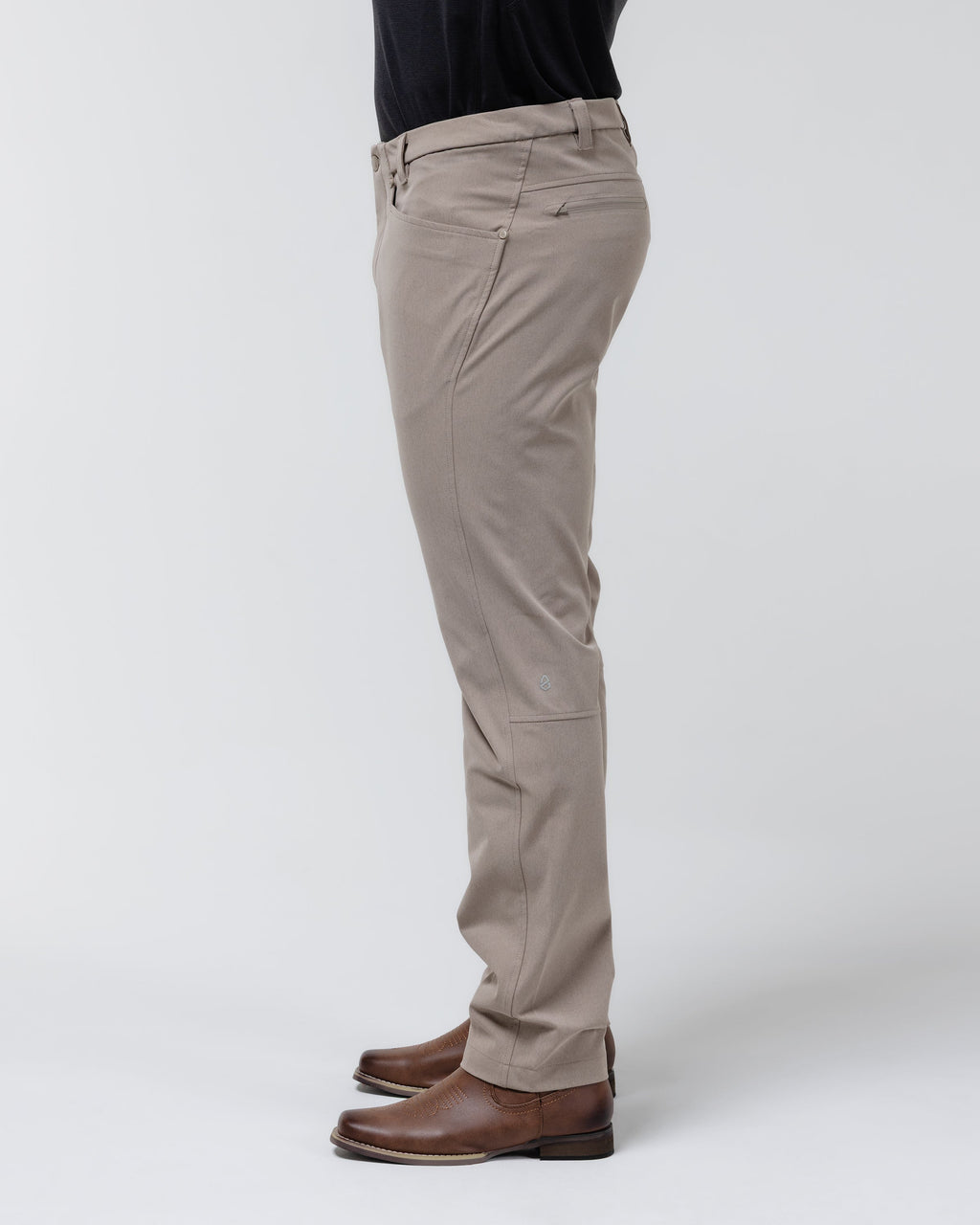 Tan chino pants side view with ankle-length hem and belt loops